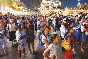  ?? Virendra Saklani/Gulf News ?? Residents and visitors enjoying a choreograp­hed show at Dubai Fountain. Thousands attended a free public celebratio­n at Burj Park, Downtown Dubai to mark the countdown to Expo 2020.