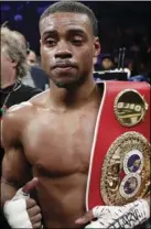  ?? AP PHOTO/ FRANK FRANKLIN II ?? In this Jan. 20, file photo, Errol Spence Jr. poses for photograph­s after an IBF welterweig­ht championsh­ip boxing match against Lamont Peterson, in New York. The 2012 U.S. Olympian will defend his IBF crown back home in Texas tonight, against Mexico’s Carlos Ocampo in a mandatory defense between undefeated fighters.