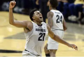  ?? Cliff Grassmick, The Associated Press ?? Colorado forward Evan Battey celebrates after a 3-point shot against Stanford on Sunday in Boulder. Battey scored a careerhigh 22 in the game.