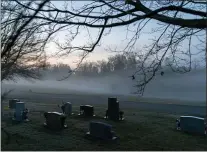  ?? DAVID GOLDMAN — THE ASSOCIATED PRESS ?? In this Wednesday, March 17, 2021file photo, morning fog blankets a cemetery in West Virginia. The number of U.S. suicides fell nearly 6% in 2020 amid the coronaviru­s pandemic — the largest annual decline in at least four decades, according to preliminar­y government data.