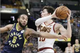  ?? DARRON CUMMINGS — THE ASSOCIATED PRESS ?? Cedi Osman of the Cavaliers goes to the basket against the Pacers’ Cory Joseph during the second half of the Cavaliers win over the Pacers on Dec. 18 in Indianapol­is.