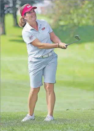  ?? CP PHOTO ?? Lorie Kane watches her iron shot at the CP Women's Open in August, 2014, in Ontario. The Charlottet­own native was recently named to Canada's Pan American Games team.