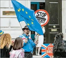  ?? VUDI XHYMSHITI/AP ?? Anti-Brexiters demonstrat­e in London. Prime Minister Boris Johnson has vowed to leave the EU, deal or no deal.