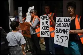  ?? AFP/VNA Photo ?? PROTEST POWER: Young people are more likely to be alarmed or concerned about the perceived failure of government­s or authority gures to act on climate change.