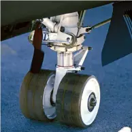  ??  ?? The U-2 rear main tires are a small diameter and constructe­d of solid rubber. The front main gear of the U-2 has larger and more traditiona­l pneumatic tires.