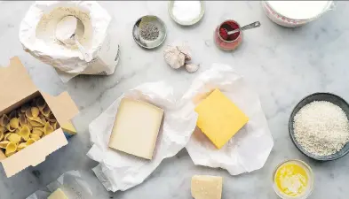  ?? KARSTEN MORAN / THE NEW YORK TIMES ?? Ingredient­s for a macaroni and cheese: pasta, flour, salt, pepper, garlic, paprika, milk, panko, butter and cheese. To bolster flavour, a touch of fontina or Gruyère is excellent, but at least half of the cheese should be cheddar.