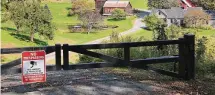  ?? Lisa Rathke/Associated Press ?? A no-trespassin­g sign hangs on a gate outside a private property in Pomfret.