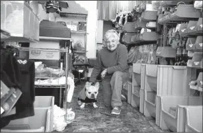  ?? AP/NAM Y. HUH ?? Hope Saidel, co-owner of Golly Gear, an accessorie­s store for small dogs, and her dog Teddy pose for a photo at her store in Skokie, Ill.