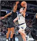  ?? TREVOR RUSZKOWSKI/USA TODAY SPORTS ?? Marquette guard Tyler Kolek drives past Colorado forward Tristan da Silva during an NCAA Tournament game Sunday in Indianapol­is.