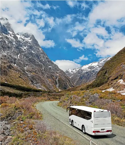  ??  ?? Accommodat­ion providers try to persuade visitors heading to Milford Sound to travel by bus.