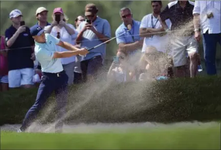  ?? BRAD HORRIGAN — HARTFORD COURANT VIA AP ?? Jordan Spieth hits his second shot on the ninth hole during the third round of the Travelers Championsh­ip on Saturday in Cromwell.