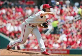  ?? JEFF ROBERSON — THE ASSOCIATED PRESS ?? Philadelph­ia Phillies starting pitcher Aaron Nola throws during the first inning of a baseball game against the St. Louis Cardinals, Sunday in St. Louis.