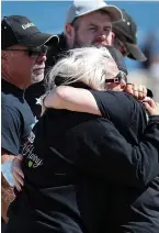  ??  ?? Emotional...Charlotte hugs relative