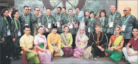  ??  ?? Ongkili (standing sixth right) in group photo with members of the delegation at the Astana Expo 2017. — Bernama photo