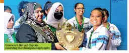  ?? ?? Gateway’s Netball Captain receiving the Championsh­ip trophy