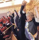  ?? STEVE HELBER/AP FILE ?? Supporters of the Equal Rights Amendment cheer a ratification vote last year by the Virginia legislatur­e, which a federal judge says was decades too late.