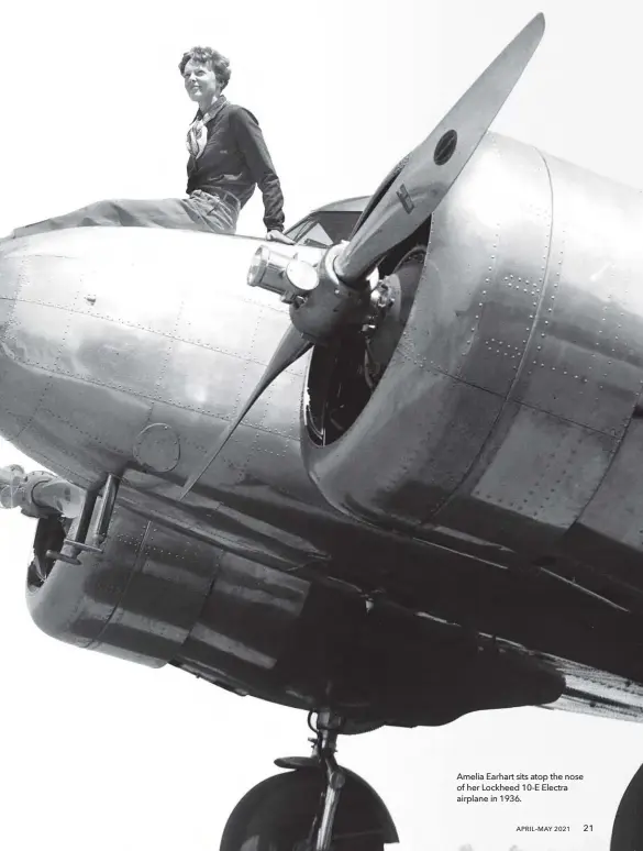  ??  ?? Amelia Earhart sits atop the nose of her Lockheed 10-E Electra airplane in 1936.