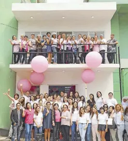  ??  ?? One big happy family: Partners from Pink for Life, Philippine Foundation for Breast Care Inc., Estee Lauder and The Peninyears sula Manila at the entrance to the Breast Care Center Annex