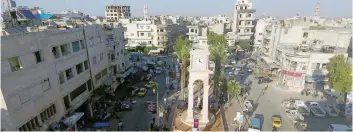  ?? — Reuters ?? A general view taken with a drone shows the Clock Tower of the rebel-held Idlib city.