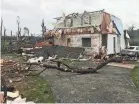  ?? SARA KARNES/USA TODAY NETWORK ?? A home in Rogersvill­e, Mo., was damaged and moved several feet off its foundation by the storms Tuesday.