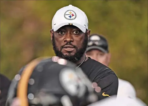  ?? Peter Diana/Post-Gazette ?? A year ago, Mike Tomlin would have been on the practice field with Steelers rookies. Today, he’s learning how to coach in a different way, one that is anything but hands on.