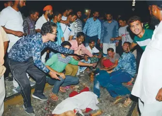  ?? AFP ?? ■ The scene after a train ran over a crowd during Dussehra festivitie­s in Amritsar yesterday.