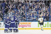  ?? MIKE EHRMANN GETTY IMAGES ?? Yanni Gourde of the Tampa Bay Lightning celebrates a goal against the Boston Bruins at Amalie Arena in Tampa, Fla., on Monday night.