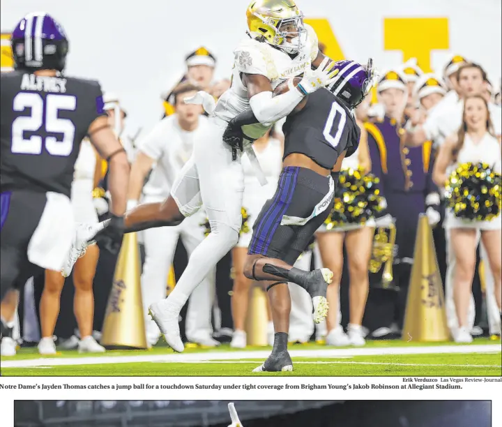  ?? Ashley Landis The Associated Press ?? UCLA quarterbac­k Dorian Thompson-robinson signals a first down Saturday during the No. 18 Bruins’ 42-32 upset victory over No. 11 Utah at the Rose Bowl.