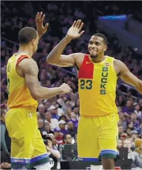  ?? AP FOTO ?? WE DID IT. Milwaukee Bucks’ George Hill (left) and Sterling Brown celebrate after their win over the Philadelph­ia 76ers.