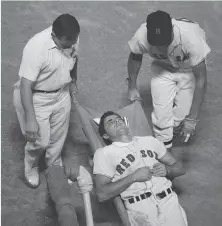  ?? Bettmann Archive 1967 ?? Boston’s Tony Conigliaro is carried off the field unconsciou­s after being hit in the left cheek by Jack Hamilton’s pitch.