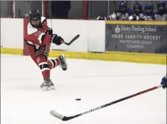  ?? Pete Paguaga / Hearst Connecticu­t Media ?? Fairfield co- op’s Sam Swanson takes a shot against Darien at the Darien Ice House on Saturday.