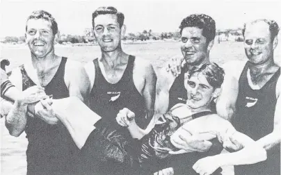  ?? PHOTOS: ODT FILES ?? What a moment . . . Oamaru rowers (from left) Win Stephens, Keith Heselwood, George Paterson and Bill Smedley prepare to throw cox Doug Pulman into the drink after winning Empire Games gold in Perth in 1962.