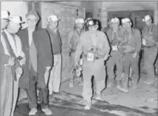  ?? FILE — THE ASSOCIATED PRESS ?? In this file photo, the second of two seven-man teams exits the Athas portal mine shaft of the Consolidat­ed Coal Co., near Farmington, W.Va., after their search for 78 trapped miners.