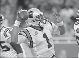  ?? File, Paul Sancya / The Associated Press ?? Carolina quarterbac­k Cam Newton throws downfield during a game against the Lions.