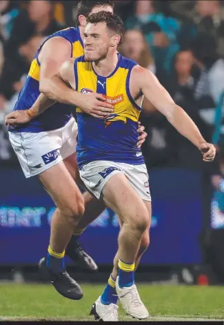  ?? MATCH- DEFINING: Luke Shuey celebrates kicking the winning goal against Port Adelaide. ??