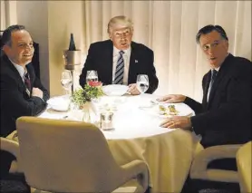  ?? Evan Vucci The Associated Press ?? In New York in 2016, Donald Trump, center, eats dinner with Mitt Romney, right, and Trump Chief of Staff Reince Priebus.