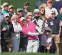  ?? MATT SLOCUM/AP ?? Rory McIlroy chips to the second green during the second round at the Masters on Friday in Augusta, Ga.