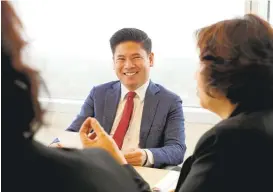  ?? JIM GENSHEIMER/STAFF ?? San Jose Councilman Lan Diep meets with city staff from the Enviroment­al Services Department at City Hall. He is a Republican with bipartisan credential­s.