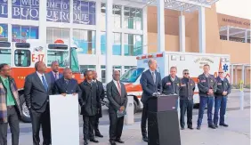  ?? SOURCE: CITY OF ALBUQUERQU­E ?? Albuquerqu­e Mayor Richard Berry, at the podium, with city fire personnel on the right and a Zambian delegation at left, announces the donation of a fire pumper truck to its Sister City of Lusaka, Zambia.