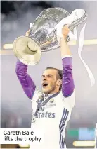  ??  ?? Gareth Bale lifts the trophy