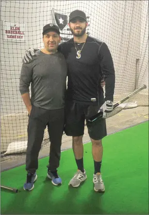  ?? Photo by Ernest A. Brown ?? Lincoln native and Seattle Mariners minor-league prospect Nick Zammarelli, right, poses with his dad Nick Jr. following a recent batting practice session.