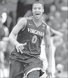  ?? Andy Lyons Getty Images ?? SENIOR DEVON HALL has helped lift Virginia to the No. 1 seeding in the NCAA tournament. The Cavaliers’ tough defense should take them far.