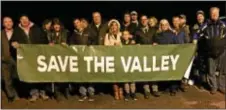  ?? LESLIE KROWCHENKO — DIGITAL FIRST MEDIA ?? Concord residents displayed a “Save the Valley” sign prior to the township planning commission meeting to consider Concord Ventures.