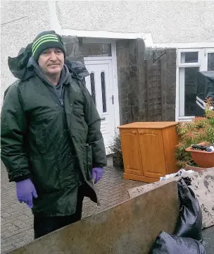  ??  ?? Boards across Kim Jenkins’ drive on Talgarth Street in Maesteg could not stop the flood