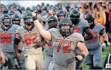  ?? [SARAH PHIPPS/THE OKLAHOMAN] ?? Oklahoma State's Johnny Wilson (72) is one of four offensive linemen with starting experience in the Cowboys' lineup.