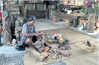  ??  ?? Panom Klahan, 65, has made wooden bells for buffaloes and oxen since he was 20 years old. His products are made from the bark of the jackfruit tree and rosewood, which are not too heavy for cattle when the bell is hung around their necks. He also...