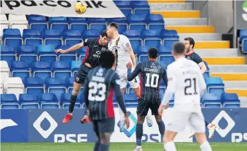  ?? ?? Heads we win Tom Parkes rises the highest to nod home Livi’s dramatic late winner