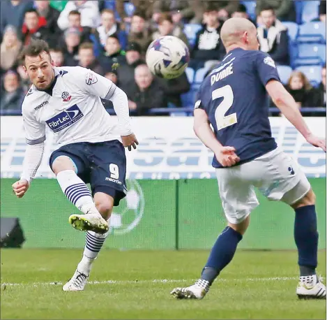  ?? PICTURES: Action Images ?? ONE FOR THE CAMERAS: Adam Le Fondre scores the second goal for Bolton and his fifth since signing