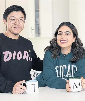  ?? TRACY HANES FOR THE TORONTO STAR ?? Tim Liu and Mandy Yazdan are among the young homebuyers who looked beyond the GTA to buy their first home. The couple, who both work remotely in the financial industry, chose to buy in Cobourg.