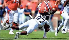  ?? / AP-Richard Shiro ?? Clemson quarterbac­k Kelly Bryant is tackled by Georgia Southern’s Kenderick Duncan Jr. during the first half of the game on Saturday in Clemson, S.C.